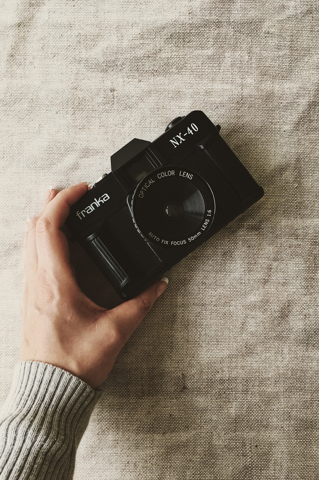 Person Holding Black Franka Nx-40 Slr Camera